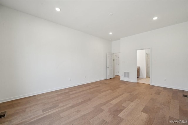 spare room featuring light hardwood / wood-style floors