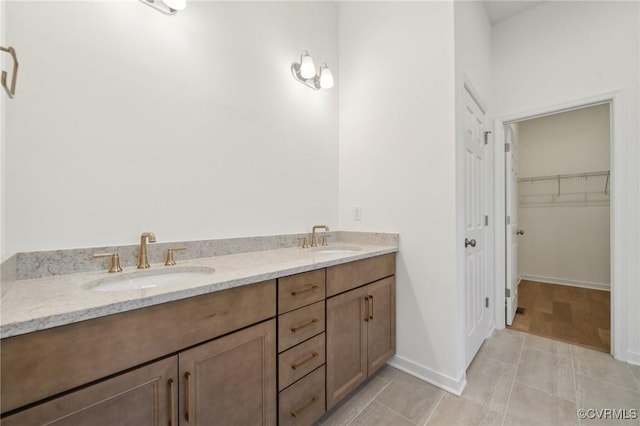 bathroom with vanity and tile patterned flooring