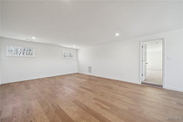 spare room featuring light hardwood / wood-style flooring