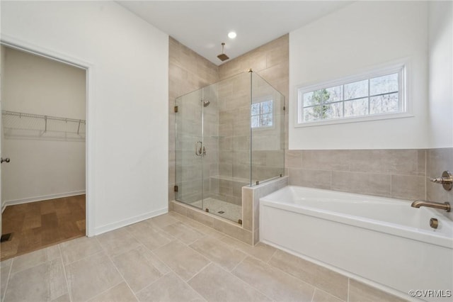 bathroom featuring independent shower and bath and tile patterned flooring