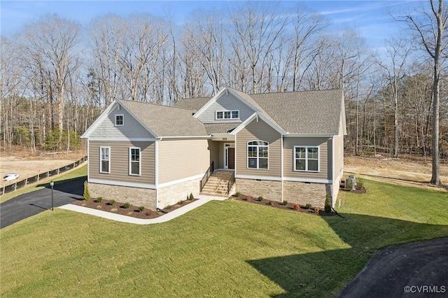 craftsman-style house with central AC and a front lawn