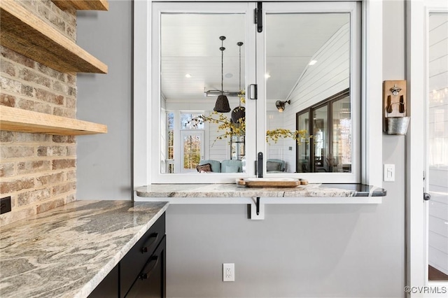 kitchen featuring light stone countertops