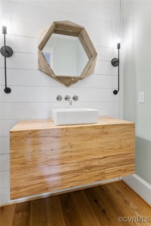 bathroom featuring vanity and hardwood / wood-style floors