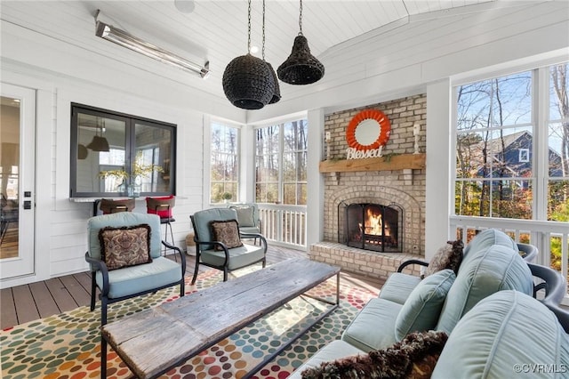 sunroom featuring a fireplace