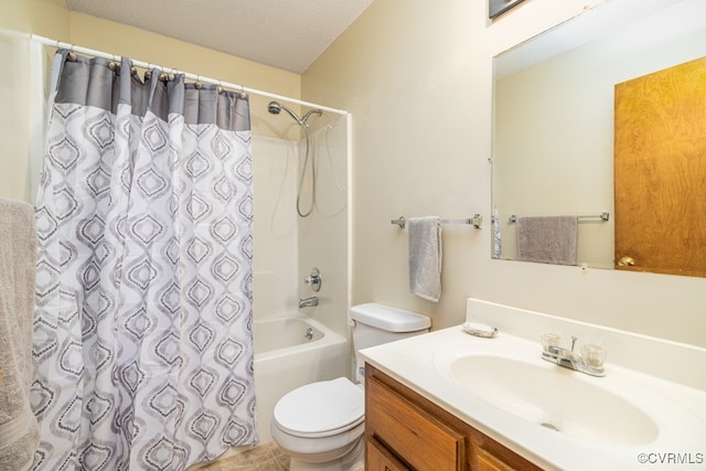 full bathroom with vanity, toilet, shower / bath combo with shower curtain, and a textured ceiling