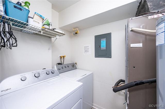 laundry area with washing machine and clothes dryer and electric panel