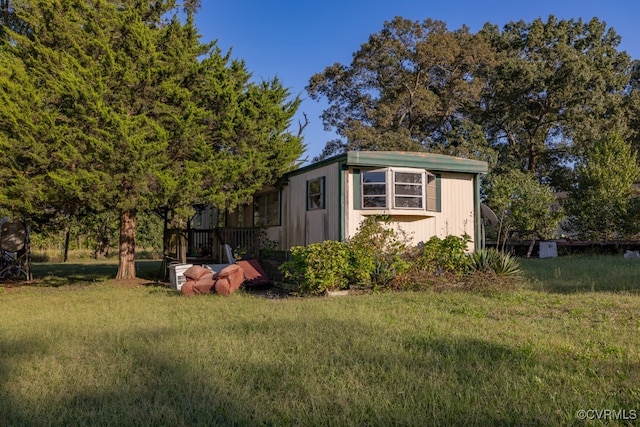 view of outdoor structure with a yard