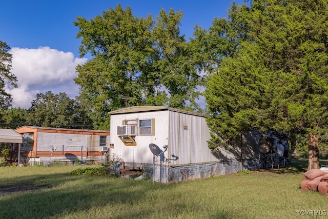 view of outbuilding featuring a yard