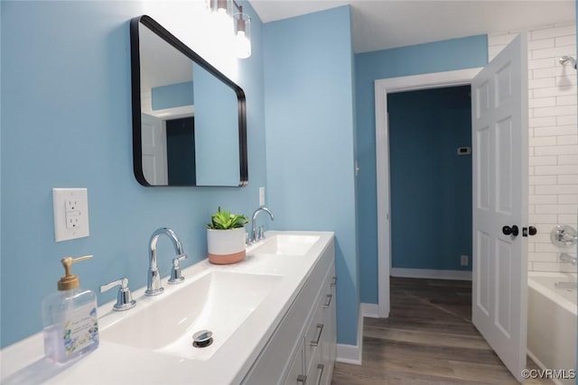 bathroom with wood-type flooring and vanity