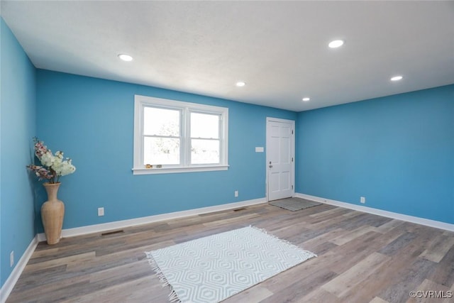 unfurnished room featuring wood-type flooring