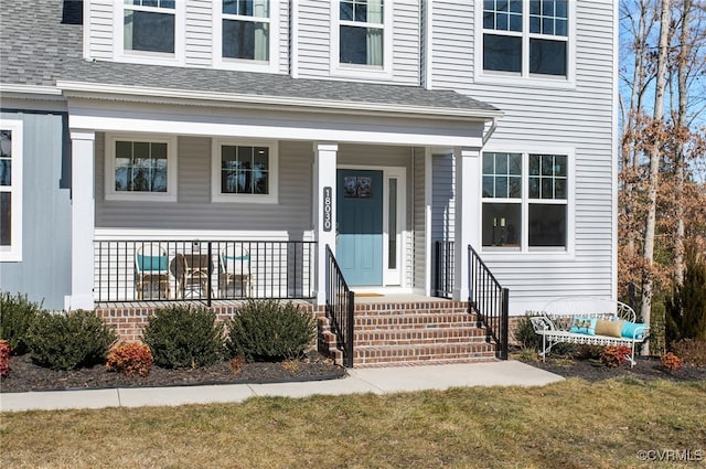 doorway to property featuring a yard