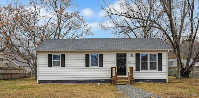 bungalow featuring crawl space, a shingled roof, a front yard, and fence