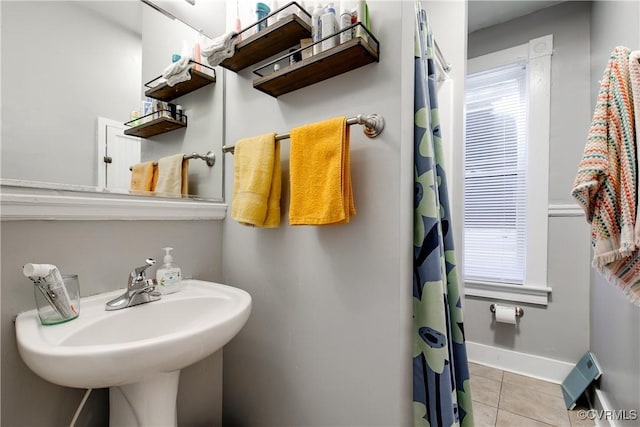 bathroom with sink and tile patterned flooring