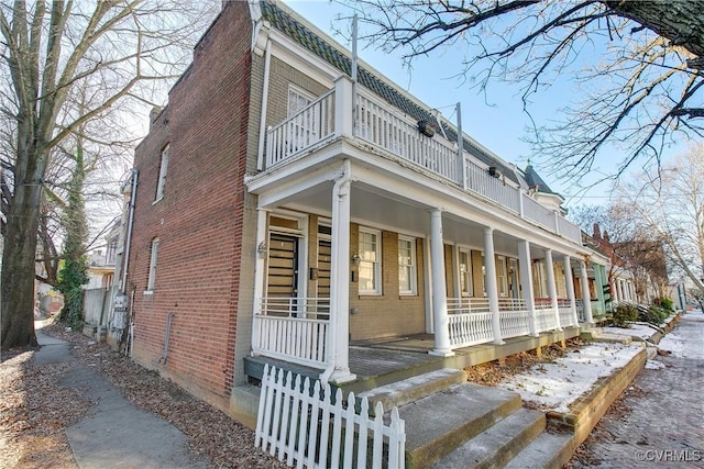 view of side of property with a porch