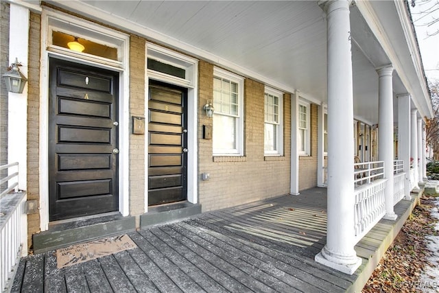 doorway to property featuring covered porch