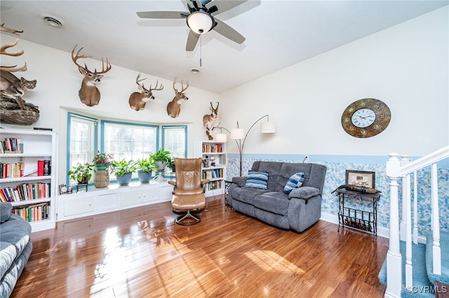 sitting room featuring ceiling fan and hardwood / wood-style floors