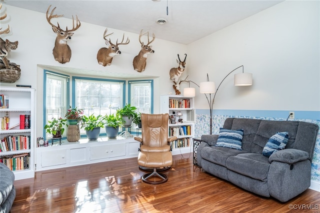 sitting room featuring hardwood / wood-style floors