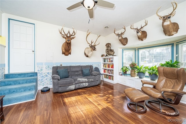 living room with hardwood / wood-style flooring and ceiling fan