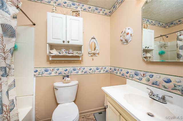 full bathroom featuring vanity, shower / bathtub combination with curtain, a textured ceiling, and toilet