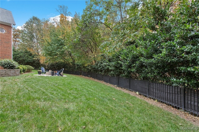 view of yard with a fire pit