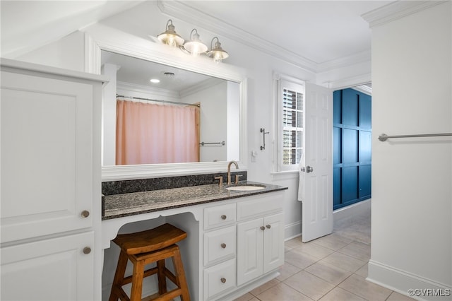 bathroom featuring tile patterned flooring, crown molding, vanity, and a shower with curtain