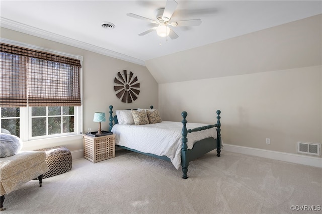 bedroom featuring ceiling fan, light colored carpet, ornamental molding, and vaulted ceiling