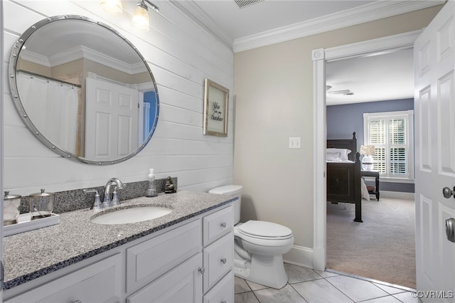 bathroom featuring crown molding, tile patterned floors, vanity, and toilet