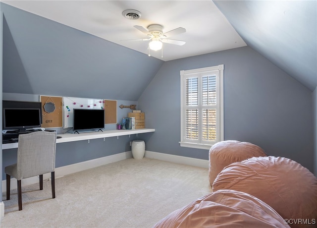 carpeted home office with ceiling fan and lofted ceiling