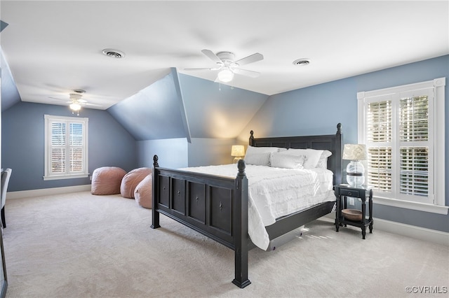 bedroom featuring lofted ceiling, light carpet, and ceiling fan