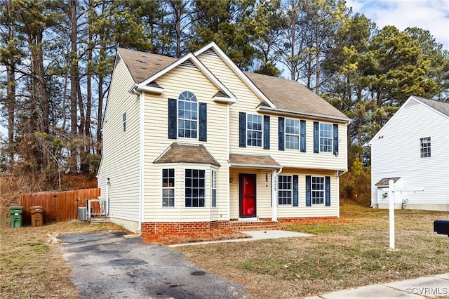 colonial inspired home with a front yard