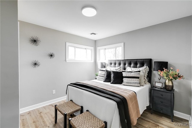 bedroom featuring wood-type flooring