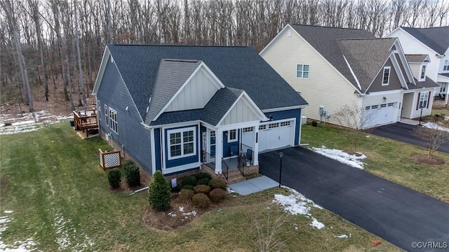 view of front of house with a garage and a front yard