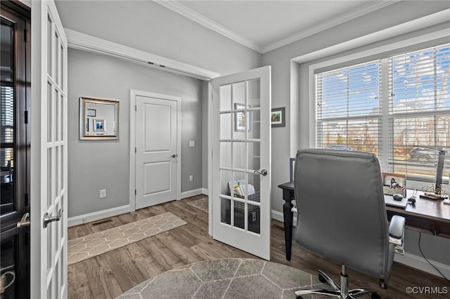 office area with baseboards, visible vents, ornamental molding, wood finished floors, and french doors