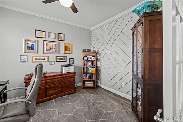 office with dark wood-style floors, ornamental molding, a ceiling fan, and baseboards