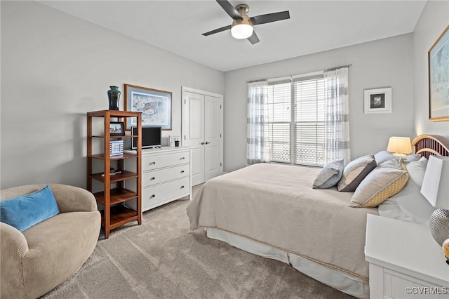 bedroom featuring a closet, carpet flooring, and ceiling fan