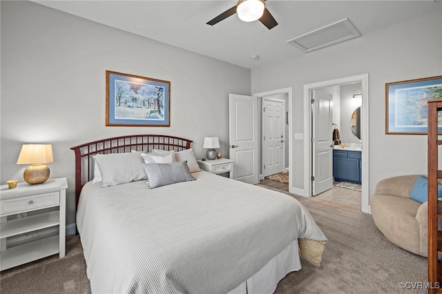 bedroom featuring carpet, attic access, ceiling fan, and connected bathroom