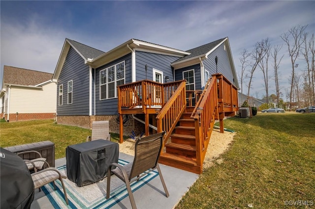 back of property featuring stairs, a deck, central AC, and a yard