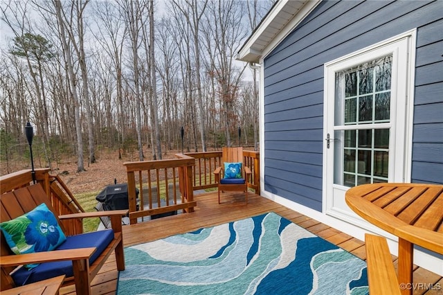 wooden terrace featuring area for grilling