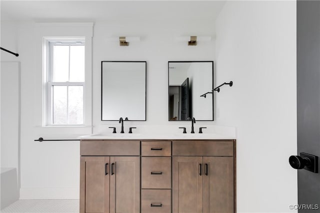 bathroom featuring vanity and plenty of natural light