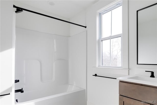 bathroom featuring vanity and tub / shower combination