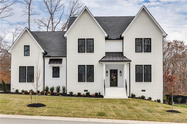 modern farmhouse featuring a front yard