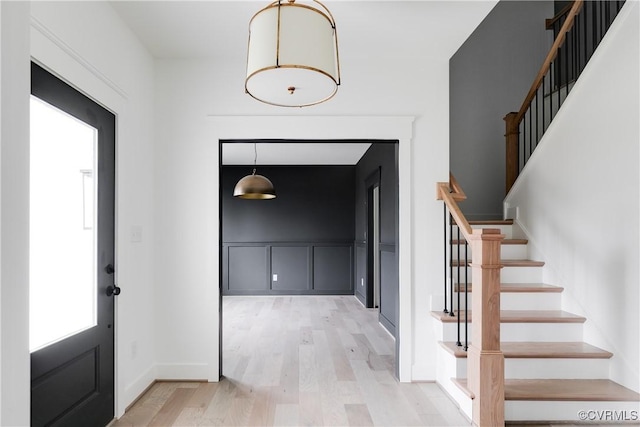 foyer with light hardwood / wood-style floors