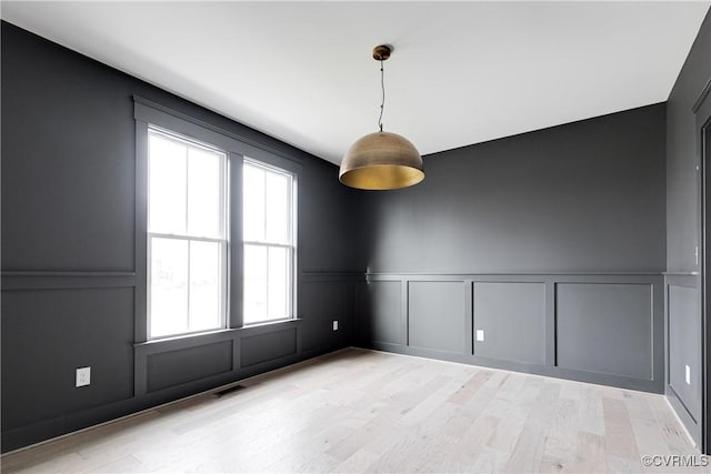 empty room with light wood-type flooring