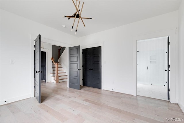 spare room with light wood-type flooring