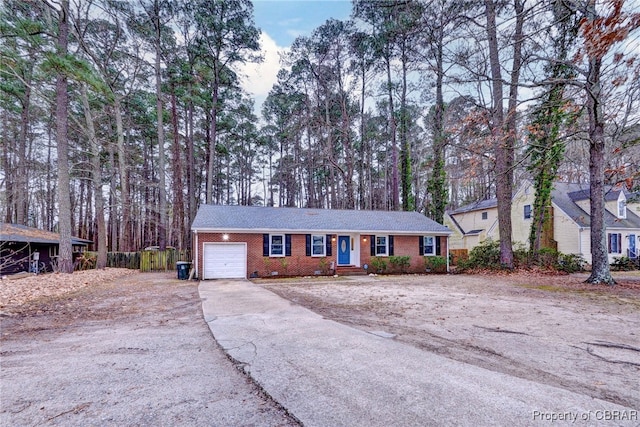 ranch-style home featuring a garage