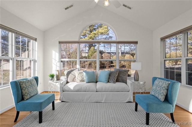 sunroom featuring vaulted ceiling