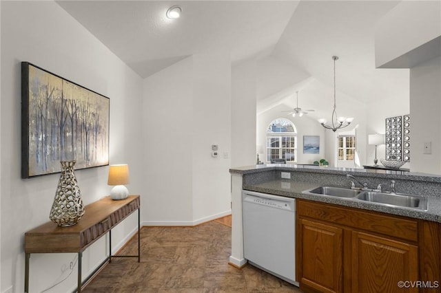 kitchen with lofted ceiling, sink, hanging light fixtures, a notable chandelier, and white dishwasher