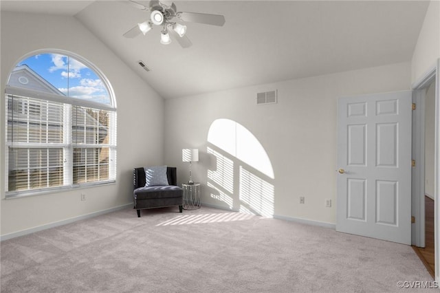 sitting room featuring lofted ceiling, light colored carpet, and ceiling fan