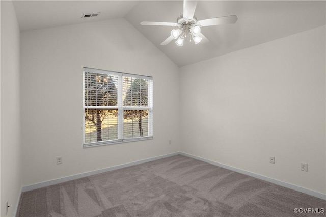 carpeted empty room with lofted ceiling and ceiling fan