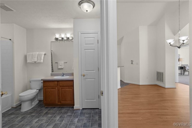 full bathroom with toilet, bathing tub / shower combination, vanity, a notable chandelier, and hardwood / wood-style flooring